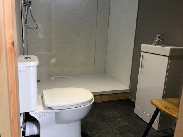 The separate bathroom with a walk-in shower