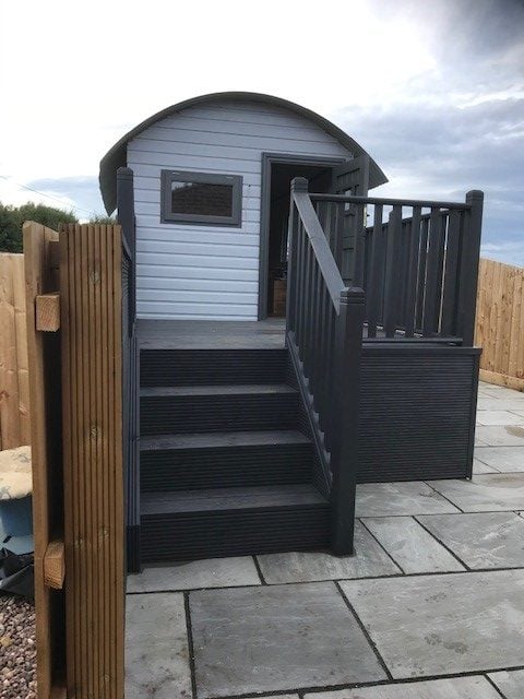 Mabel’s grey shepherd’s hut, with steps leading to her private deck